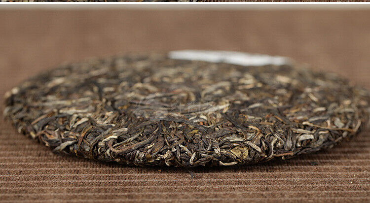 Xiaguan Qian Jia Zhai Wild Aged Old Tree Round Cake Puer Raw Pu'er Tea 357g